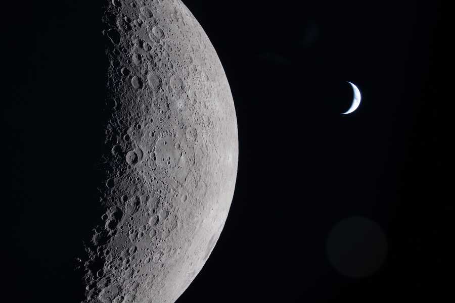 This photo from the Artemis II lunar flyby shows the partially illuminated moon.