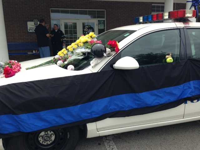 May 26, 2013: They left mementos on Ellis' car, flowers and stuffed animals and baseballs with personal messages, since the sport had been a huge part of Ellis' life.