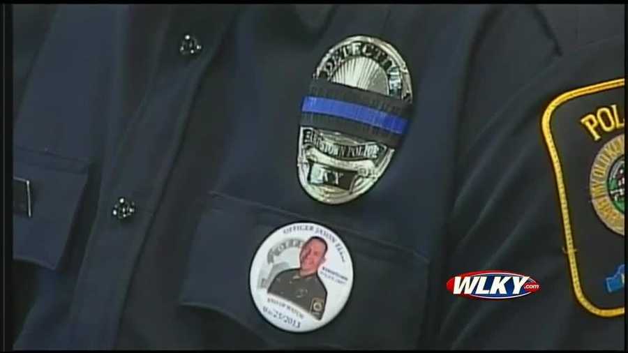 March 9, 2014: The Bardstown Police Department hangs mementos and photos of the funeral and burial for Ellis in a hallway of their office as a memorial.