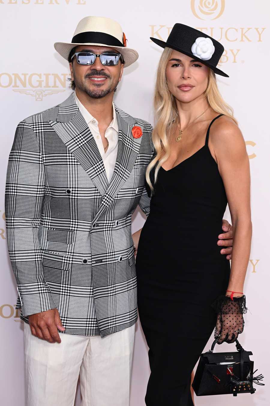 LOUISVILLE, KENTUCKY - MAY 02: (L-R) Luis Fonsi and Águeda López attend the Kentucky Derby 152 at Churchill Downs on May 02, 2026 in Louisville, Kentucky. (Photo by Daniel Boczarski/Getty Images for Churchill Downs)