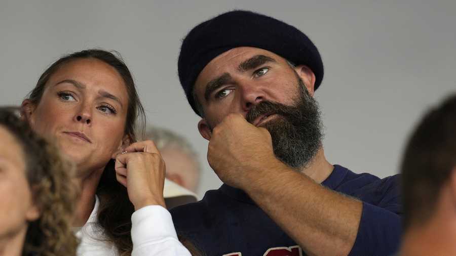 Recently retired Philadelphia Eagles lineman Jason Kelce and wife Kylie watch the women&apos;s field hockey match between the Argentina and United States, at the Yves-du-Manoir Stadium, at the 2024 Summer Olympics, Saturday, July 27, 2024, in Colombes, France. (AP Photo/Anjum Naveed)