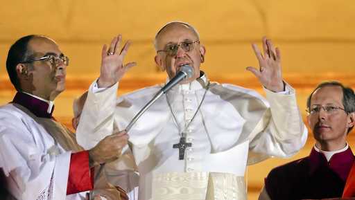 FILE - Argentine Cardinal Jorge Bergoglio, who chose the name of Pope Francis, waves to the crowd from the central balcony of St. Peter&apos;s Basilica after being elected 266th pontiff of the Roman Catholic Church, at the Vatican, Wednesday, March 13, 2013. (AP Photo/Gregorio Borgia, file)