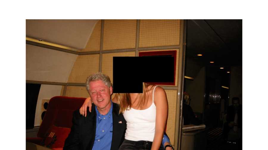 This undated, redacted photo released by the U.S. Department of Justice shows former President Bill Clinton with an unknown person. (U.S. Department of Justice via AP)