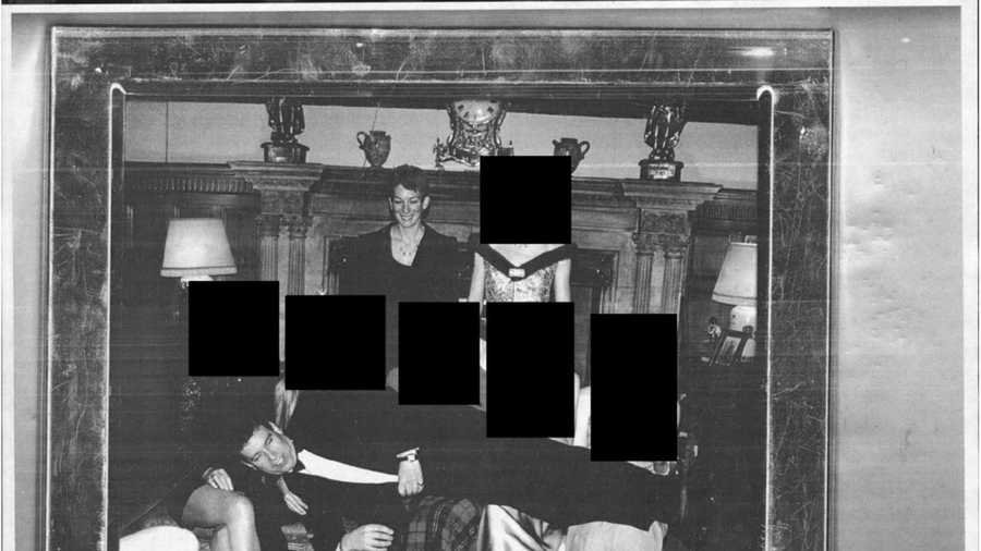 This redacted photo released by the U.S. Department of Justice shows Andrew Mountbatten-Windsor laying across several people&apos;s laps with Ghislaine Maxwell standing above. (U.S. Department of Justice via AP)