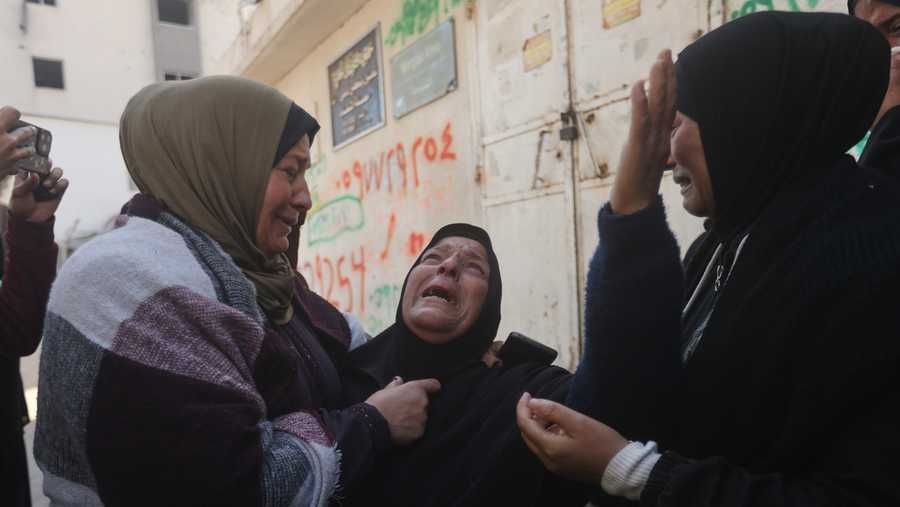 Palestinians mourn over people killed in an Israeli strike during their funeral at Al-Shifa Hospital in Gaza City Saturday, April 25, 2026.