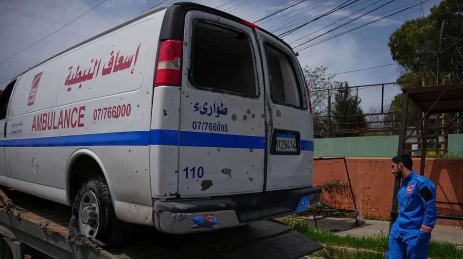 Members of Nabatiyeh Emergency Services inspect the damaged ambulance of their colleague who was killed on a rescue mission by an Israeli airstrike on Wednesday, in Nabatiyeh, southern Lebanon, Friday, April 17, 2026.
