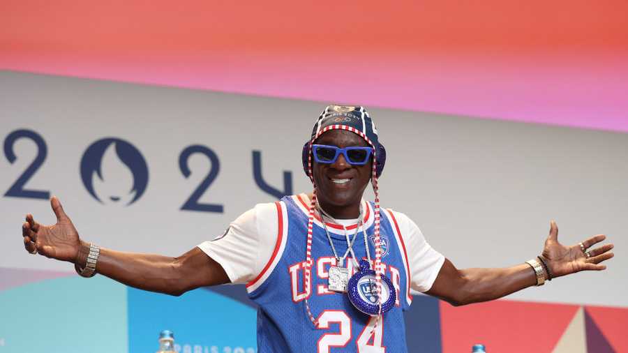 PARIS, FRANCE - JULY 26: Flavor Flav speaks during a Team USA Water Polo press conference at the Main Press Centre on July 26, 2024 in Paris, France. (Photo by Mike Lawrie/Getty Images)
