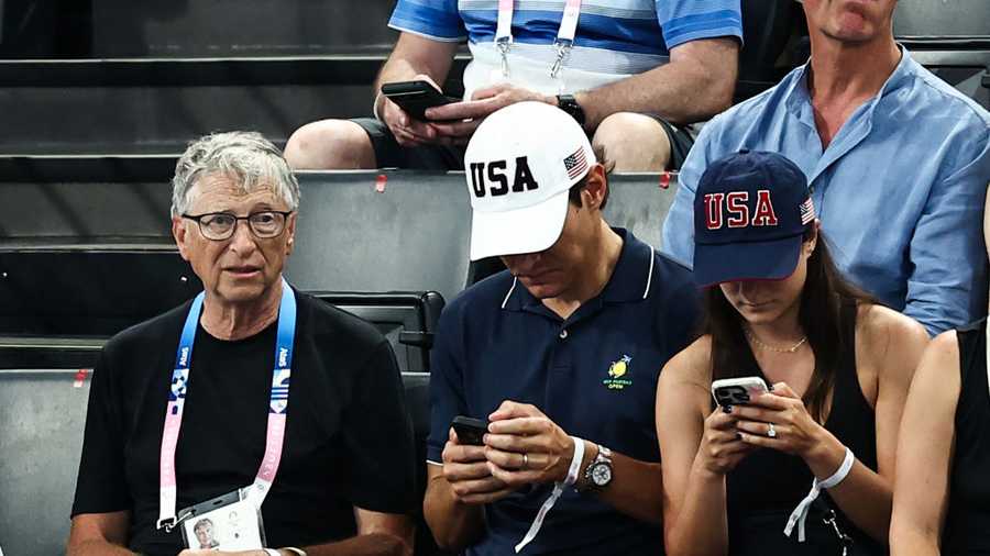 US businessman Bill Gates (L) waits for the start of the artistic gymnastics women&apos;s team final during the Paris 2024 Olympic Games at the Bercy Arena in Paris, on July 30, 2024. (Photo by Anne-Christine POUJOULAT / AFP) (Photo by ANNE-CHRISTINE POUJOULAT/AFP via Getty Images)