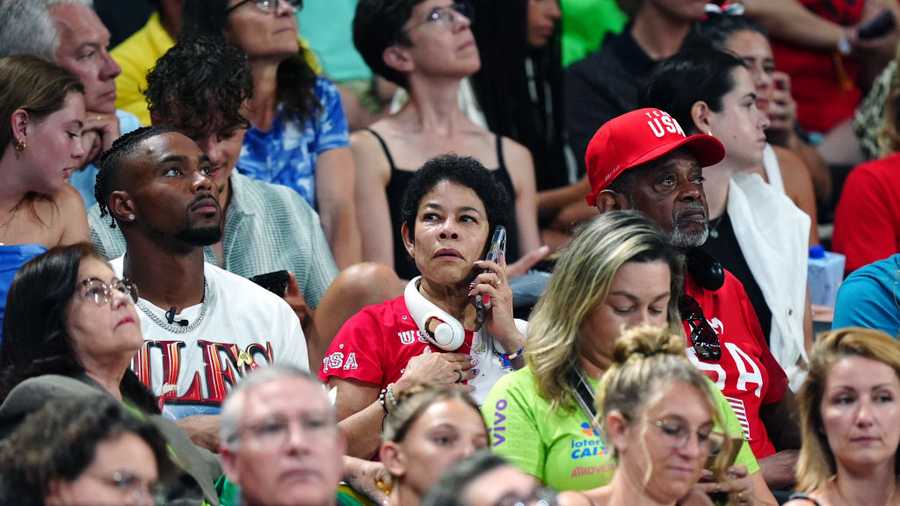Jonathan Owens sits with Nellie and Ronald Biles, husband and parents of USA&apos;s Simone Biles during the artistic gymnastics, women&apos;s team final, at Bercy Arena on the fourth day of the 2024 Paris Olympic Games in France. Picture date: Tuesday July 30, 2024. (Photo by Mike Egerton/PA Images via Getty Images)
