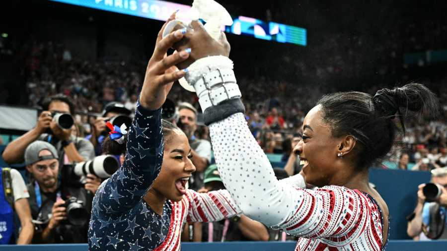US&apos; Simone Biles (R) celebrates with US&apos; Jordan Chiles s seen during the artistic gymnastics women&apos;s team final during the Paris 2024 Olympic Games at the Bercy Arena in Paris, on July 30, 2024. (Photo by Lionel BONAVENTURE / AFP) (Photo by LIONEL BONAVENTURE/AFP via Getty Images)