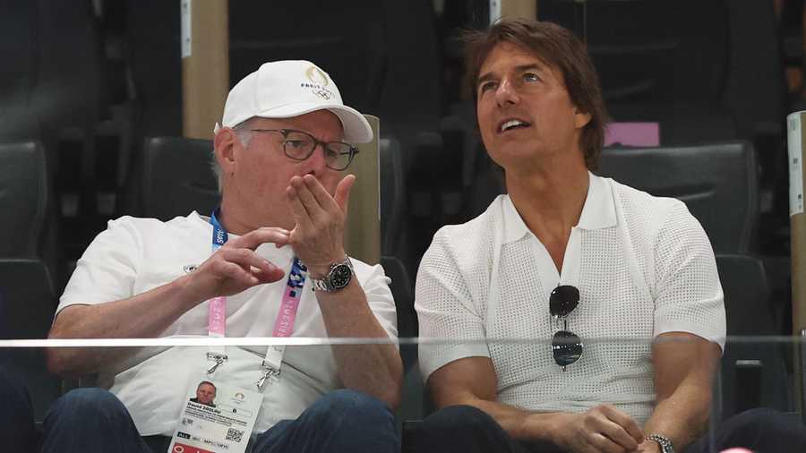 PARIS, FRANCE - JULY 28: Tom Cruise (R) speaks with David Zaslav as they attend the Artistic Gymnastics Women&apos;s Qualification on day two of the Olympic Games Paris 2024 at Bercy Arena on July 28, 2024 in Paris, France. (Photo by Jamie Squire/Getty Images)
