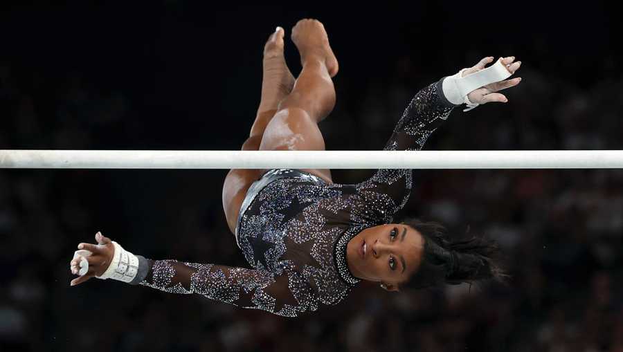PARIS, FRANCE - JULY 28: Simone Biles of Team USA competes on the uneven bars during the Women&apos;s Artistic Gymnastics Qualification on day two of the Olympic Games Paris 2024 at Bercy Arena on July 28, 2024 in Paris, France. (Photo by Naomi Baker/Getty Images)
