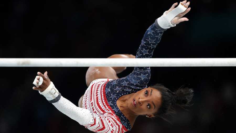 PARIS, FRANCE - JULY 30: Simone Biles of Team United States in action on the uneven bars during the Artistic Gymnastics Women&apos;s Team Final on day four of the Olympic Games Paris 2024 at Bercy Arena on July 30, 2024 in Paris, France. (Photo by Jamie Squire/Getty Images)