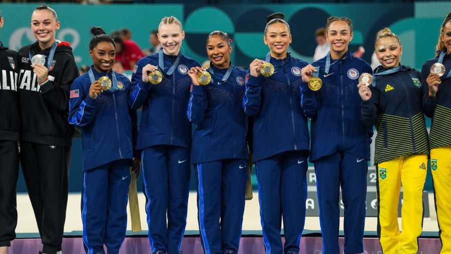 PARIS, FRANCE - JULY 30: Simone Biles of United States, Jade Carey of United States, Jordan Chiles of United States, Sunisa Lee of United States and Healy Rivera  of United States celebrate on the podium for winning the gold medal during Women&apos;s Team Final of the Artistic Gymnastics on Bercy Arena during the Paris 2024 Olympics Games on July 30, 2024 in Paris, France. (Photo By Alvaro Diaz/Europa Press via Getty Images)