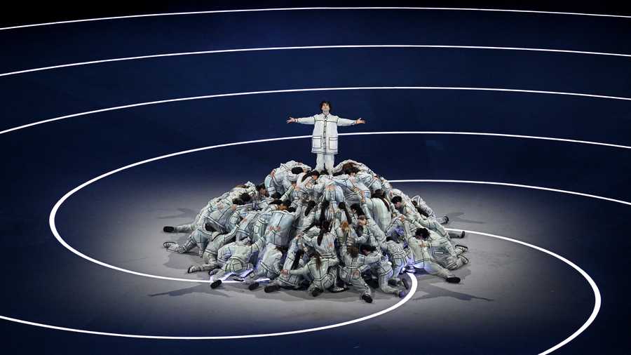 Ghali performs Promemoria (Memorandum) by Gianni Rodari during the opening ceremony of the Milano Cortina 2026 Winter Olympics at San Siro Stadium.