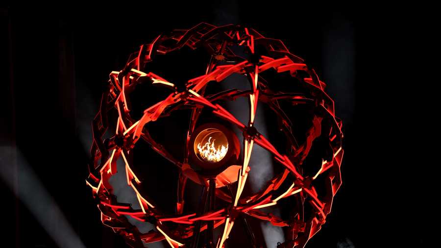 The Olympic cauldron is lit at the Arco della Pace during the opening ceremony of the Milano Cortina 2026 Winter Olympics on Feb. 6 at Piazza Dibona in Cortina d'Ampezzo, Italy.