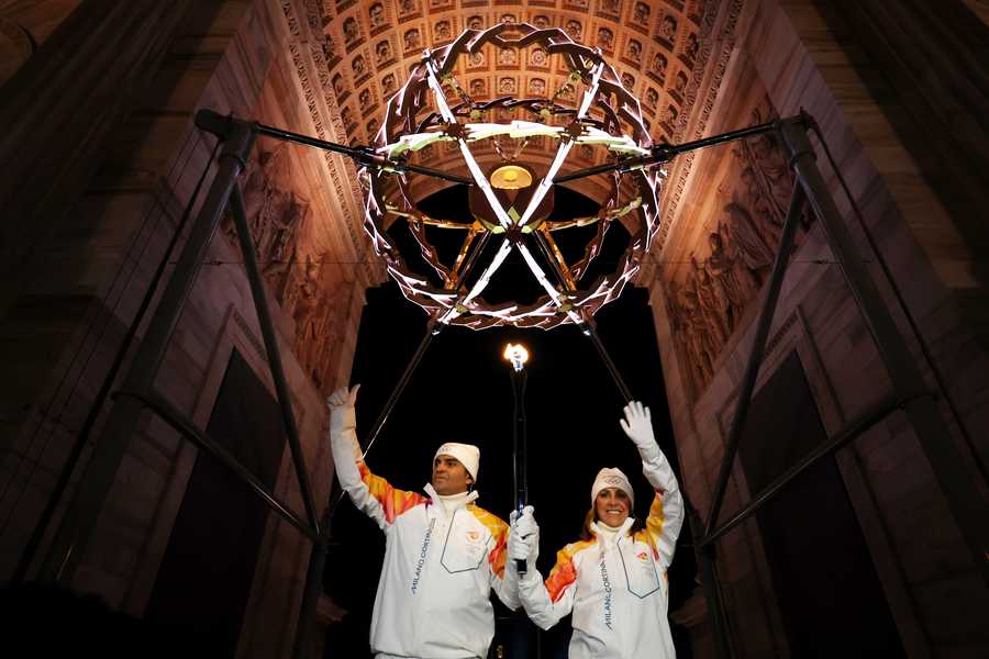 Torchbearers Deborah Compagnoni and Alberto Tomba light the Olympic cauldron during the opening ceremony of the Milano Cortina 2026 Winter Olympics at San Siro Stadium on Feb. 6 in Milan, Italy.