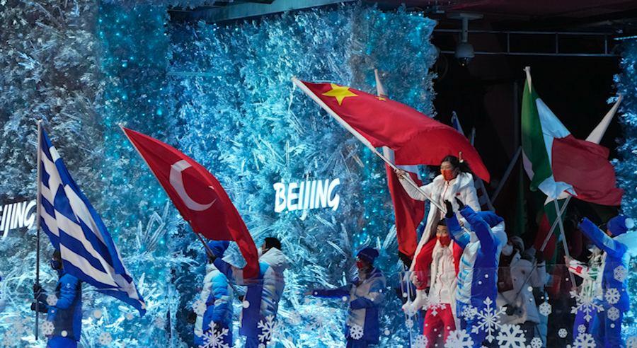 Flag bearers march into the stadium during the closing ceremony of the 2022 Winter Olympics, Sunday, Feb. 20, 2022, in Beijing.